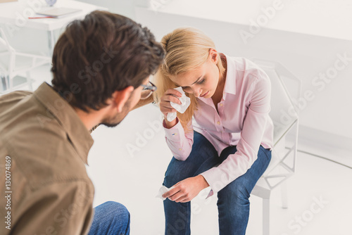 Man trying to calm down upset woman