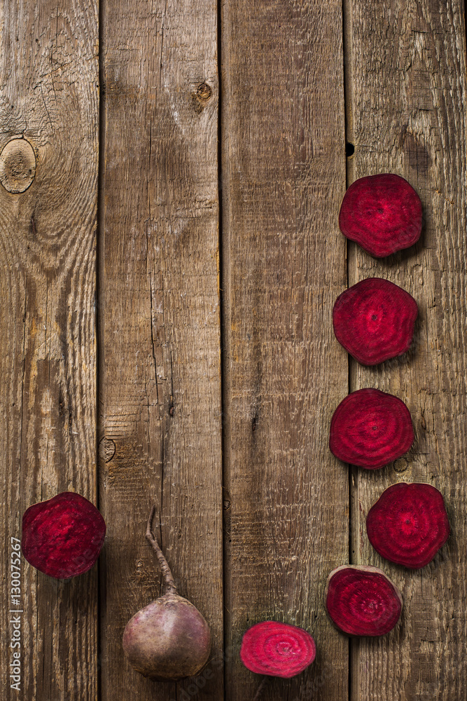 sliced beetroot on slate and wooden counter top background sliced beetroot on slate and wooden counter top background