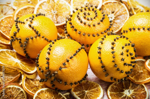 dried oranges and oranges with cloves. Christmas decorations. focus on orange
