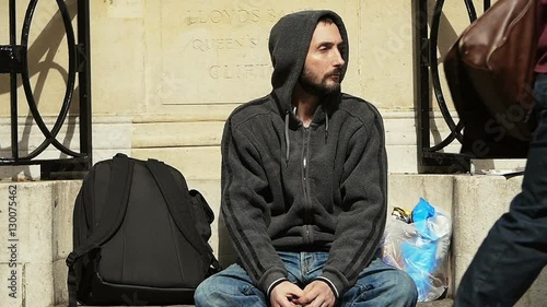 Homeless in depression. He waiting charity photo