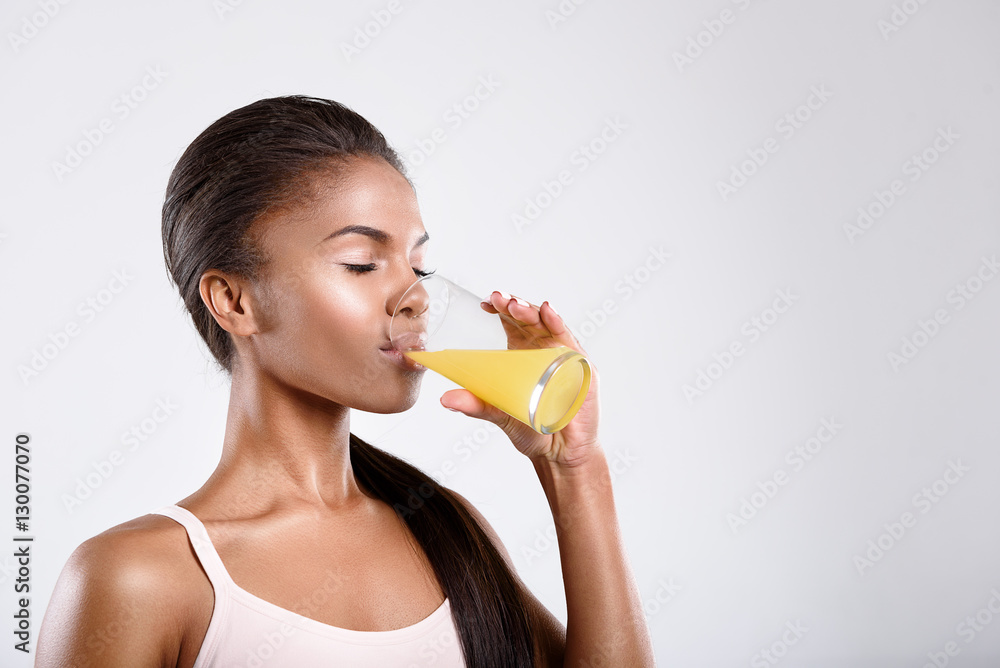 Calm fit woman is drinking juice Calm fit woman is drinking juice