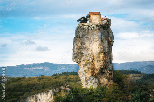 Katskhi pillar. Georgian landmarks. Man's monastery near the village of Katskhi. The orthodox church and the abbot cell on a rocky cliff. Imereti, Georgia. Georgian Meteora photo