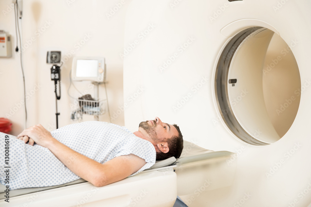 Patient getting CAT scan in a hospital Patient getting CAT scan in a hospital