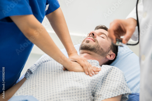 Giving cardiac massage to a patient
