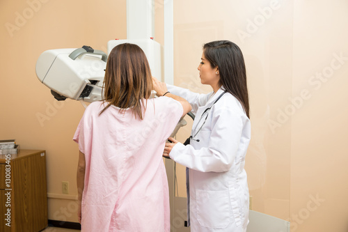 Doctor and patient during mammogram study in a hospital
