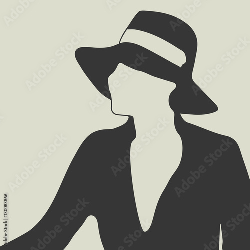 Silhouette of a beautiful woman in black hat and elegant dress