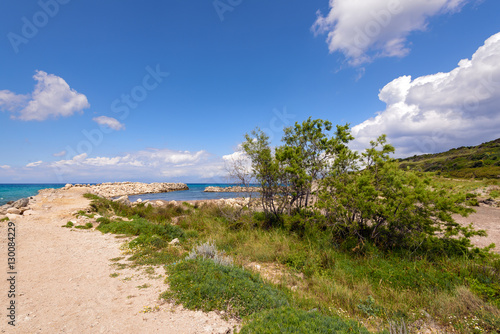 Beautiful seascape with group of trees near Acharawi beach. Corfu, Greece.