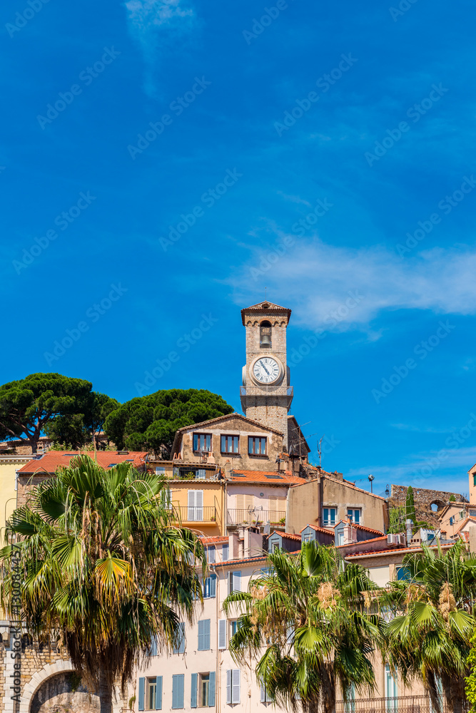 Clock Tower and Houses in City Center of Cannes, French Riviera.