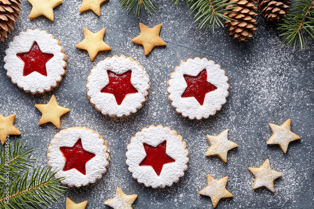 Assorted cookies. Christmas or New Year homemade cookies star with strawberry jam. Traditional Austrian dessert - Linzer biscuits. Flat lay. Festive decoration. Top view. Copy space. Assorted cookies. Christmas or New Year homemade cookies star with strawberry jam. Traditional Austrian dessert - Linzer biscuits. Flat lay. Festive decoration. Top view. Copy space.