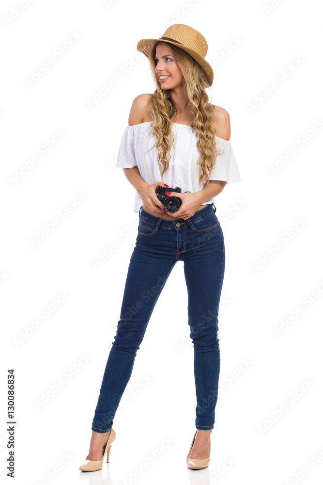 Woman Photographer With A Camera Looking Away Woman Photographer With A Camera Looking Away