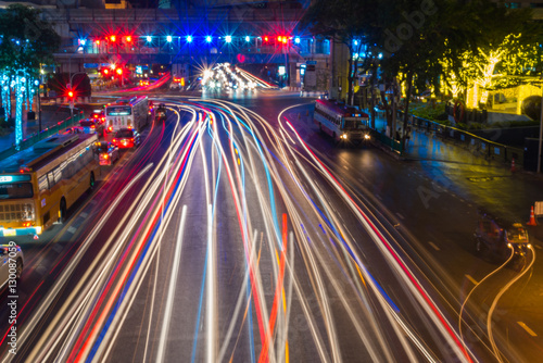 Defocused lights car traffic jam of a street road at night retro color effect