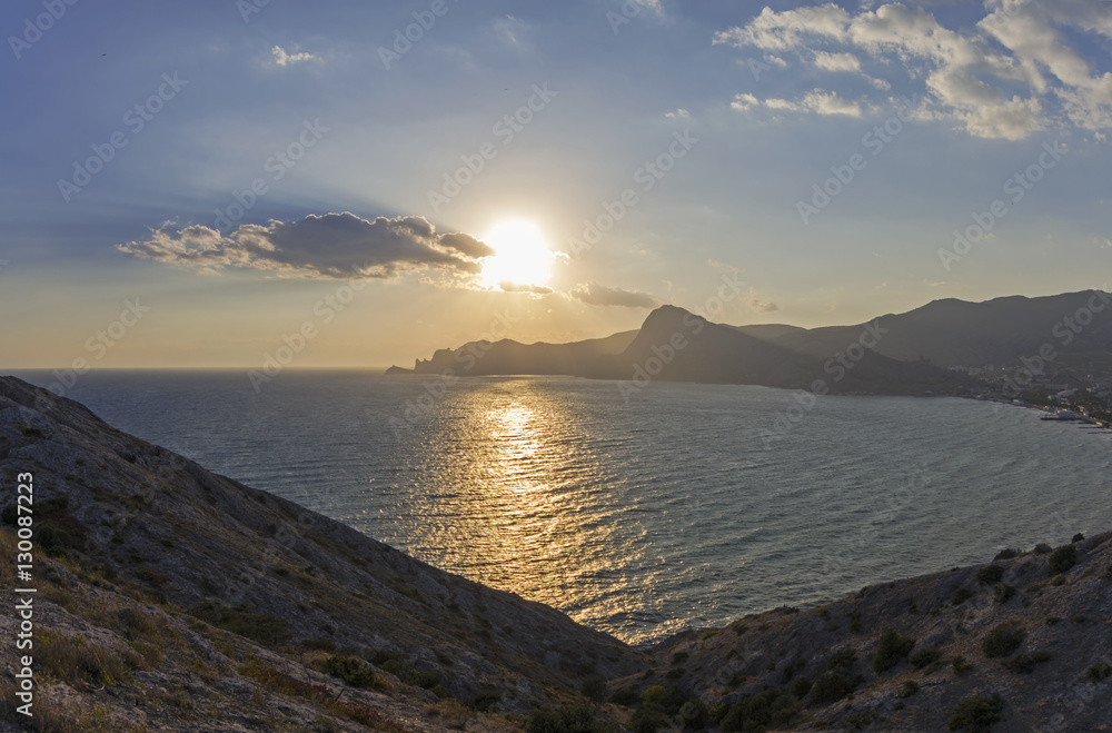 The low late afternoon sun over the coastal mountains. Crimea, S