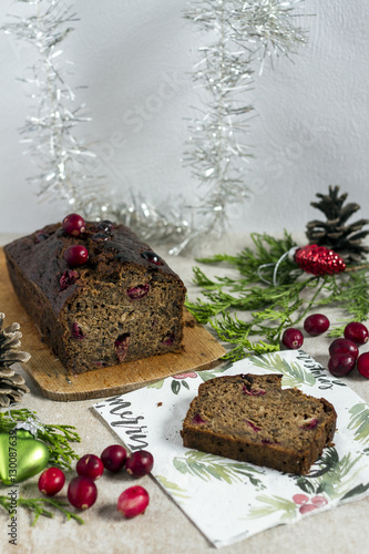 Banana bread with cranberries and almond. Christmas cake. Christmas decoration. White background.