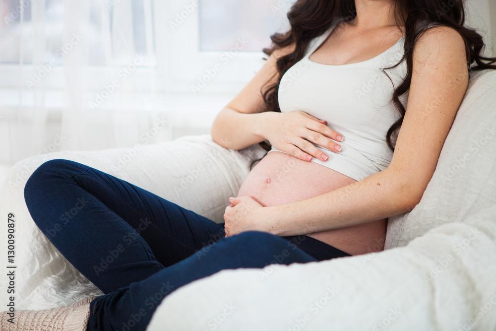 Close up Pregnancy, people and expectation concept - close up of Close up Pregnancy, people and expectation concept - close up of