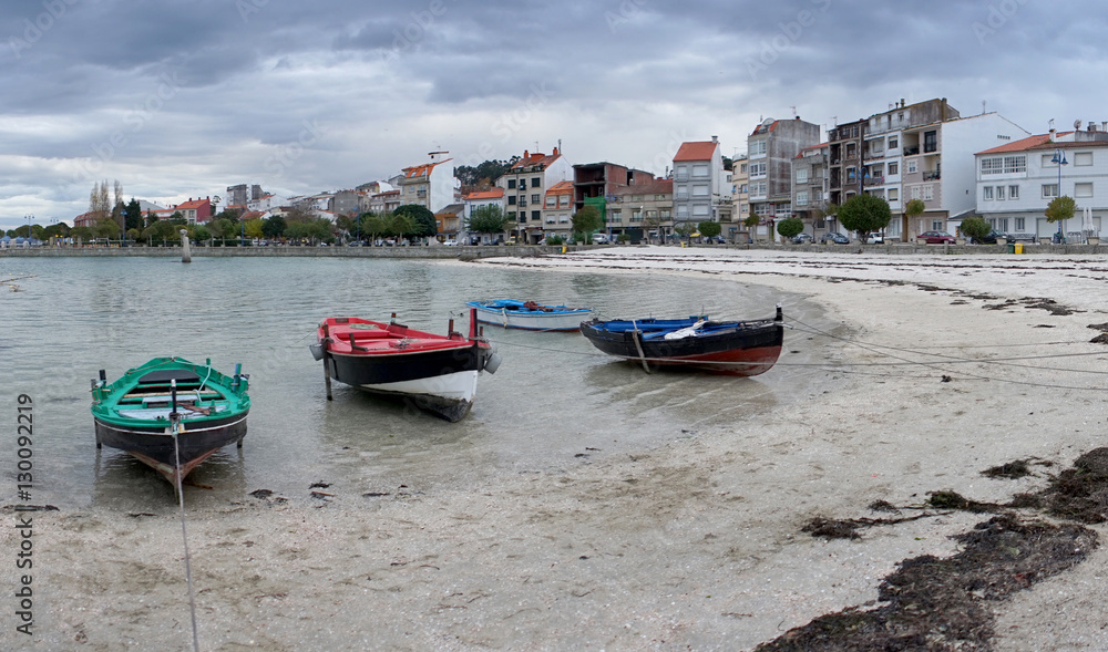 beach in galicia with fishing boats