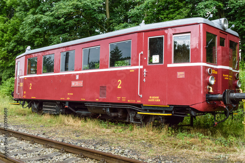 Last compartment of an empty train stationed on a grassy track