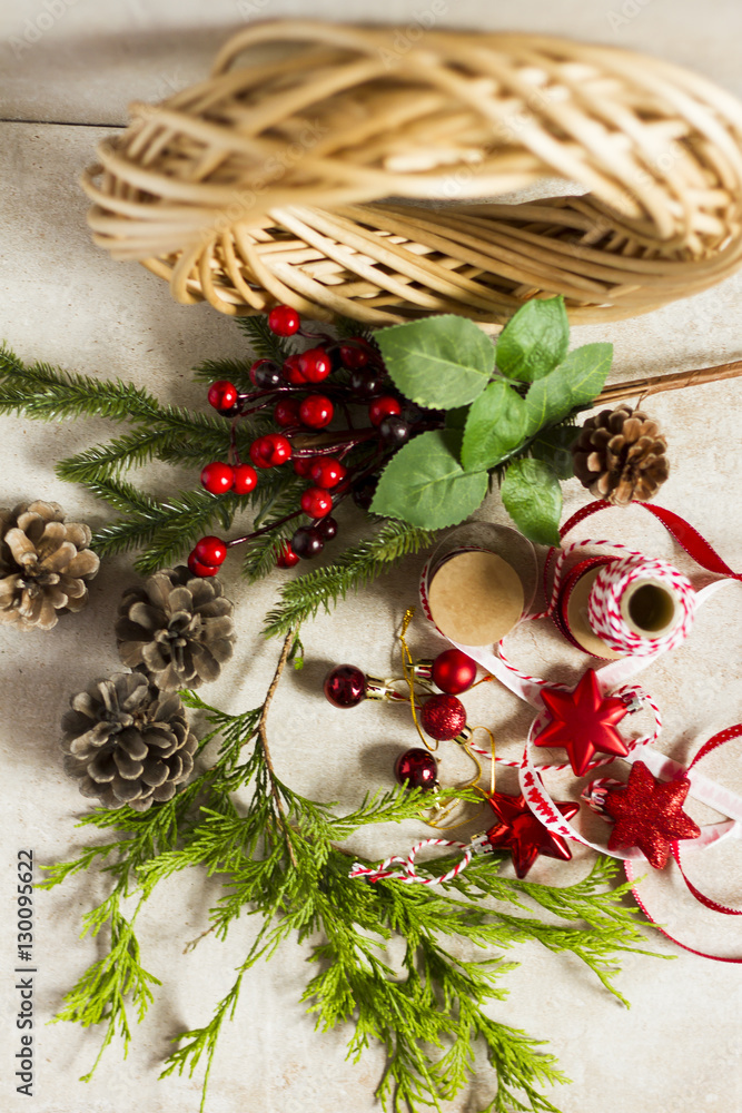 Christmas decoration. Christmas wreath, Do it yourself. Wicker, christmas baubles, pine, cones.
