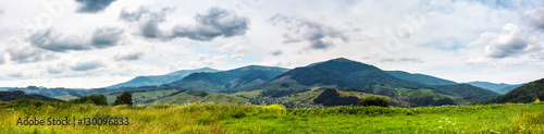 panorama of rural fields in mountains