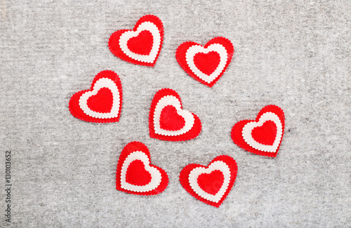 Red hearts on a gray background
