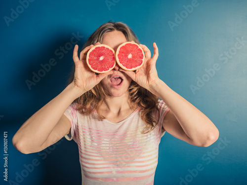 Wallpaper Mural Young woman with grapefruit binoculars Torontodigital.ca