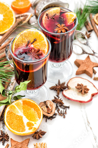 Mulled wine white background Hot winter cocktail fruits spices