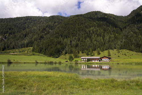 Lake Pillersee with farmhouse in Sankt Ulrich am Pillersee, Austria
