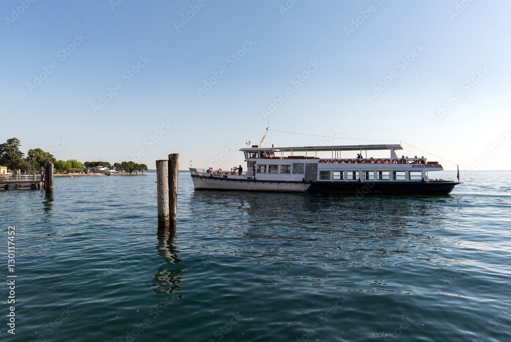  Ferry boat on  Lake Garda. Garda Lake is one of the most frequented tourist regions of Italy.