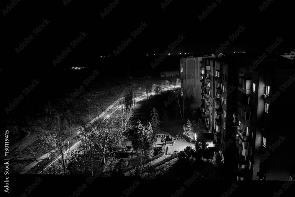 Fototapeta premium Night town look from the roof. Black and white night city