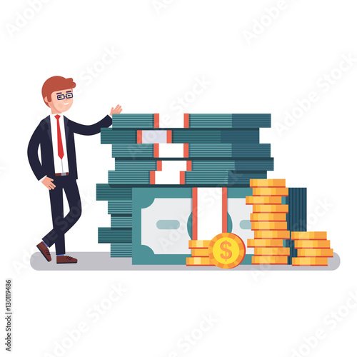 Young business man in suit showing off his money