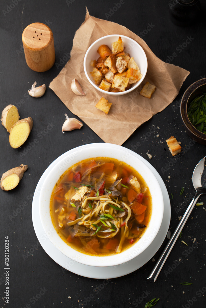 Soup with croutons, chicken, noodles and ginger Soup with croutons, chicken, noodles and ginger