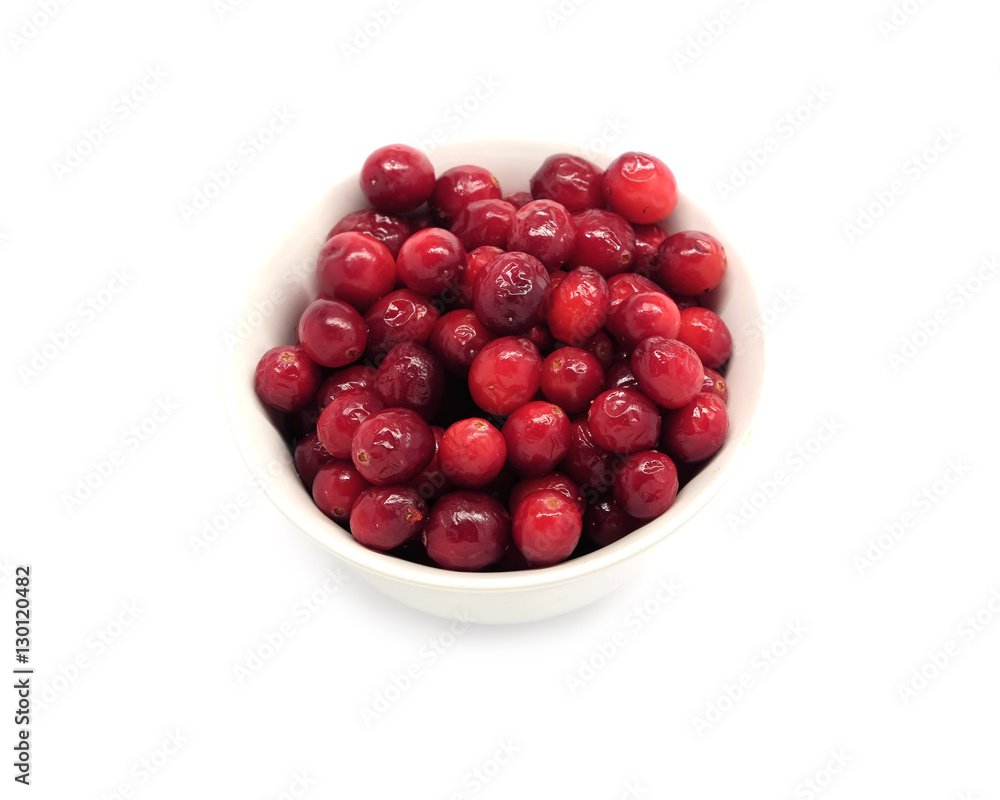 Cranberries in round white bowl isolated on white background indoor top view close up Cranberries in round white bowl isolated on white background indoor top view close up