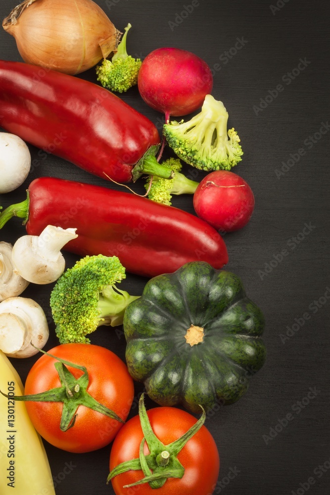 Freshly harvested organic vegetables on a wooden table. Vegetables on vintage wood background - autumn harvest. Rural still life from above with free text space.
