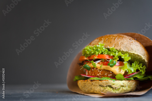 veggie burger on a black wooden background photo