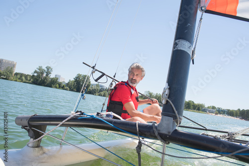 enjoying extreme sailing with racing sailboat © auremar
