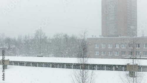 White snow is falling slowly from the sky