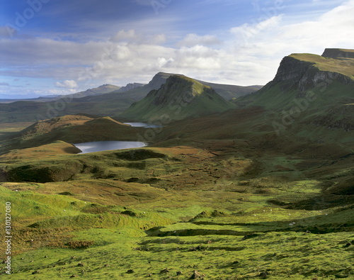 Slopes of the Quiraing, a geological wonder, its distinctive features resulting from landslips of basalt lavas upon softer sedimentary rocks beneath, northeast coast of Trotternish Peninsula, Isle of Skye, Inner Hebrides, Scotland photo