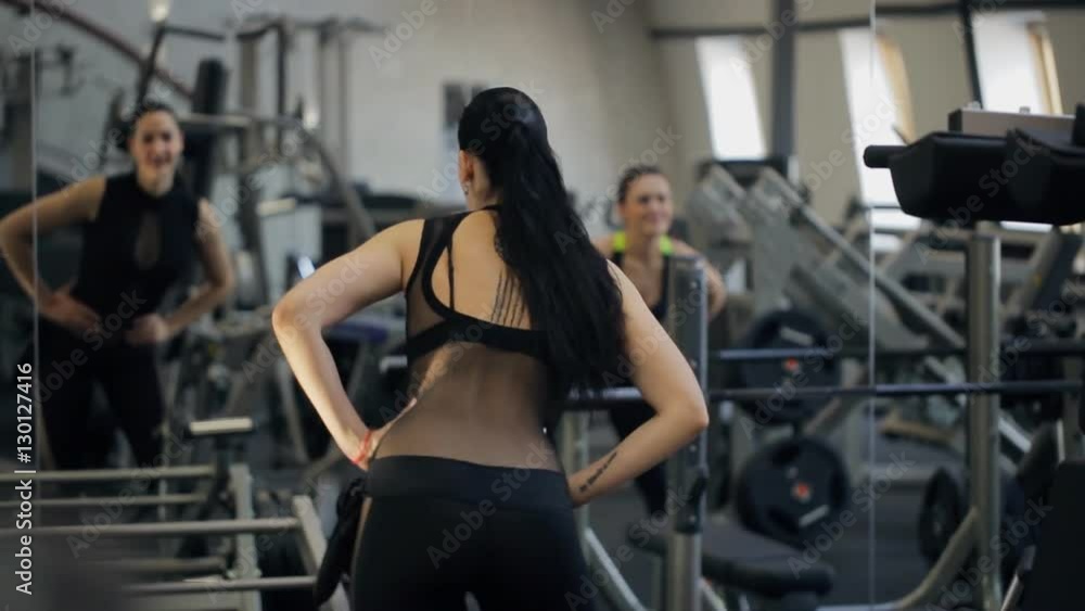 Seductive woman work out opposite to mirror. Seductive woman work out opposite to mirror.