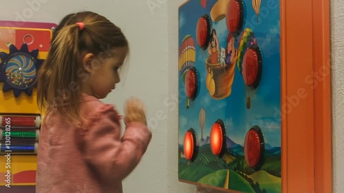 little girl playing a game on the reaction