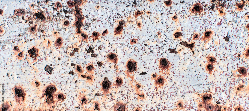 Texture of rusty metal sheet with peeled white paint Texture of rusty metal sheet with peeled white paint