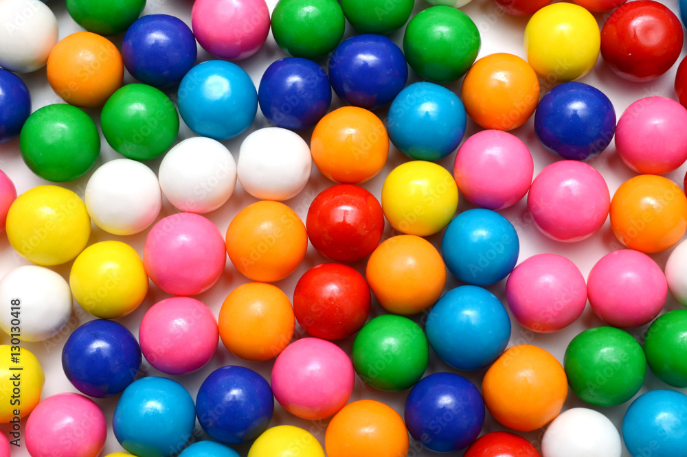 Colorful background of assorted shiny round gumballs