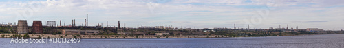 Panoramic view of ironworks on river coastline