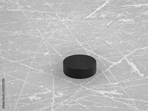 Photography Hockey puck on ice hockey rink background