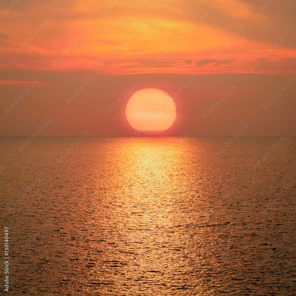 Beautiful big sunrise or sunset over the sea.