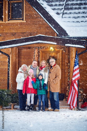 Portrait of happy family outdoor on Christmas .