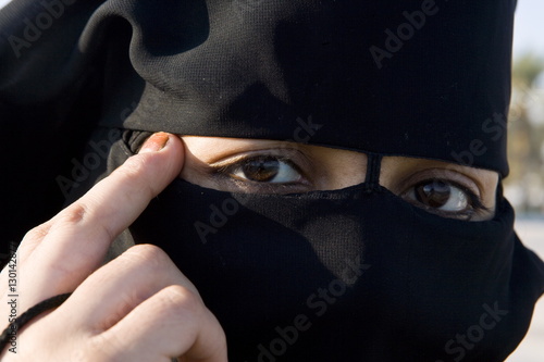 Woman wearing traditional veil, Doha, Qatar photo