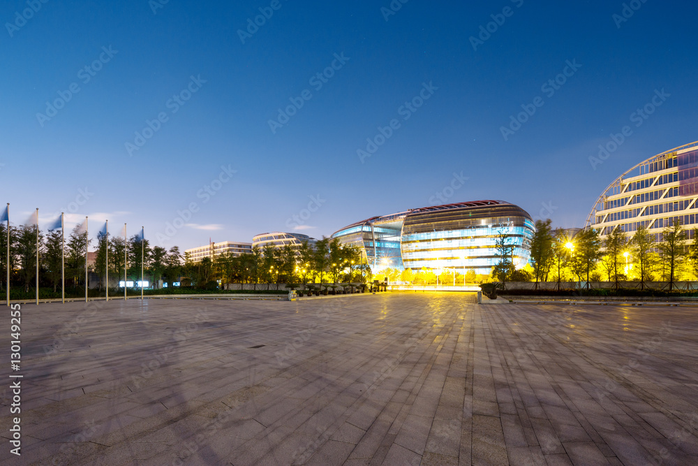 modern building from empty road at twilight