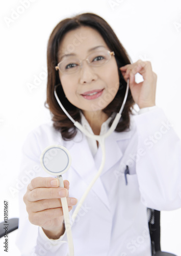 Female doctor holding stethoscope