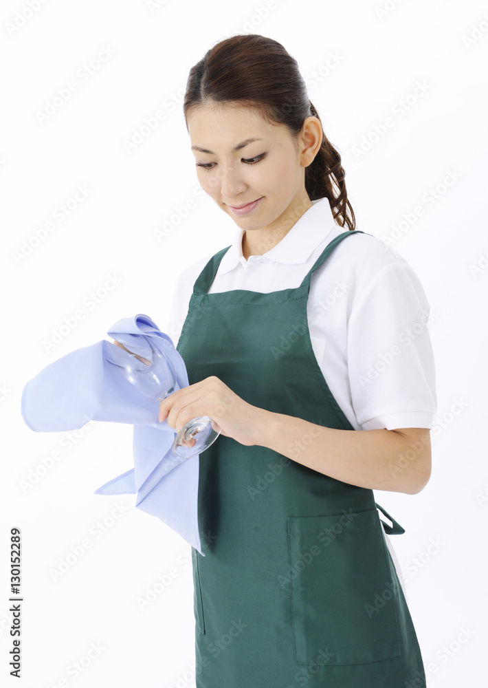 Young woman drying wine glass Young woman drying wine glass