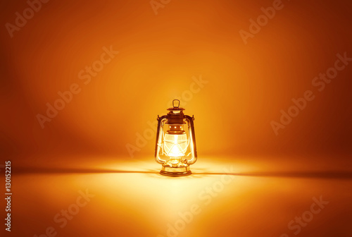 Quadro em tela Burning kerosene lamp background, concept gold light