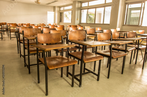Old scattered chairs in the classroom.